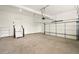 Spacious garage with stairs, shelving, and an automatic door at 847 Rolling Hill, Kennesaw, GA 30152