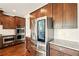 Kitchen showcases stainless steel fridge, double oven, granite countertops, and ample cabinetry at 847 Rolling Hill, Kennesaw, GA 30152