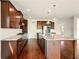 Large open kitchen features an island, granite counters, stainless appliances, and modern lighting at 847 Rolling Hill, Kennesaw, GA 30152