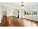 Bright living room featuring hardwood floors, a view of the front yard and elegant chandeliers at 847 Rolling Hill, Kennesaw, GA 30152
