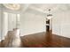 Open living room featuring hardwood floors, natural light, and elegant chandeliers at 847 Rolling Hill, Kennesaw, GA 30152