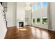 Bright living room showcasing a fireplace, beautiful floors, and backyard views at 847 Rolling Hill, Kennesaw, GA 30152