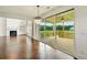 Open living room leads to a covered patio with views of the well-manicured lawn at 847 Rolling Hill, Kennesaw, GA 30152