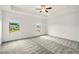 A naturally bright primary bedroom with ceiling fan, neutral carpet, and tray ceiling at 847 Rolling Hill, Kennesaw, GA 30152