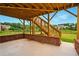 Under deck patio with brick accents and stairs to the upper deck and a manicured lawn at 847 Rolling Hill, Kennesaw, GA 30152