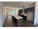 Spacious kitchen featuring a center island, modern appliances, hardwood floors and access to the outdoor space at 924 Hughley Circle # 82, Atlanta, GA 30316