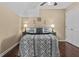 Cozy bedroom featuring a decorative quilt, neutral walls, and a ceiling fan for added comfort at 212 Lakeview Dr, Newborn, GA 30056