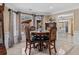 Charming dining area with a round table and large windows at 212 Lakeview Dr, Newborn, GA 30056