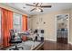Bright home office featuring hardwood floors, a ceiling fan, and a large window with a view at 212 Lakeview Dr, Newborn, GA 30056