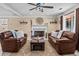 Bright living room featuring a fireplace and large windows at 212 Lakeview Dr, Newborn, GA 30056