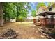Large, open backyard complete with a shed, swing set, and back deck at 2568 Redfield Dr, Norcross, GA 30071