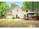 Expansive backyard featuring a deck, playset, and large grassy area at 2568 Redfield Dr, Norcross, GA 30071