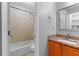 Bathroom featuring tiled shower/tub combo and wood cabinets at 2568 Redfield Dr, Norcross, GA 30071