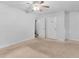 Neutral carpeted bedroom with multiple closets and bright white paint throughout at 2568 Redfield Dr, Norcross, GA 30071