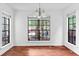 Sunny dining room featuring hardwood floors, large windows, and neutral decor at 2568 Redfield Dr, Norcross, GA 30071