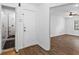 Hallway view of walk-in shower and living room with beautiful hardwood floors at 2568 Redfield Dr, Norcross, GA 30071