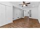 Spacious living room featuring hardwood floors, closets, ceiling fan, and french doors at 2568 Redfield Dr, Norcross, GA 30071