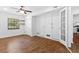Bright living room with ceiling fan, hardwood floors, natural light, and closet at 2568 Redfield Dr, Norcross, GA 30071
