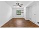 Cozy living room showcasing hardwood floors, lots of natural light, and a ceiling fan at 2568 Redfield Dr, Norcross, GA 30071