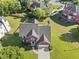 Stunning aerial view of the home and surrounding neighborhood with manicured lawns at 3226 Masters Pass Ln, Snellville, GA 30039