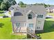 Charming backyard features a spacious deck and stairs to the well-manicured lawn at 3226 Masters Pass Ln, Snellville, GA 30039