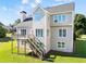 Well-maintained backyard features deck access, lush green grass and mature trees at 3226 Masters Pass Ln, Snellville, GA 30039