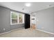 Cozy bedroom showcases a window with natural light and neutral colored walls at 3226 Masters Pass Ln, Snellville, GA 30039