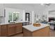 Modern kitchen with white countertops, stainless steel appliances, and a view into the living room at 3226 Masters Pass Ln, Snellville, GA 30039