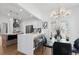 Bright kitchen with white countertops, stainless appliances, breakfast bar, and adjacent breakfast nook at 3226 Masters Pass Ln, Snellville, GA 30039