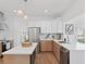 Modern kitchen with white counters, stainless steel appliances, and wood-look flooring at 3226 Masters Pass Ln, Snellville, GA 30039