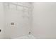 Clean laundry room features a tile floor, shelving, and washer/dryer hookups at 3226 Masters Pass Ln, Snellville, GA 30039