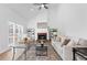Spacious living room with fireplace, light hardwood floors, and neutral decor at 3226 Masters Pass Ln, Snellville, GA 30039