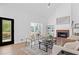 Cozy living room with a fireplace, light hardwood floors, and modern furniture at 3226 Masters Pass Ln, Snellville, GA 30039