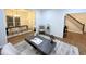 Open-concept view of living room and dining area, showcasing hardwood floors and modern decor at 3226 Masters Pass Ln, Snellville, GA 30039