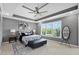 Elegant main bedroom featuring a tray ceiling, plush carpeting, and a large window at 3226 Masters Pass Ln, Snellville, GA 30039