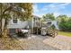 Backyard patio area with outdoor seating, a grill, and stairs to the deck, ideal for entertaining at 67 Trammell Sw St, Marietta, GA 30064