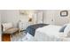 Cozy bedroom showcasing a bed with a soft color palette, complemented by a decorative rug and white trim at 67 Trammell Sw St, Marietta, GA 30064