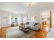 Spacious living room with hardwood floors, neutral paint, and a comfortable sofa set at 67 Trammell Sw St, Marietta, GA 30064
