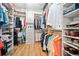Spacious walk-in closet with built-in shelving and hanging rods to maximize storage and organization at 1045 Endeavour Ct, Marietta, GA 30064