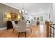 Bright and airy dining area features a modern chandelier, hardwood floors, and neutral wall colors at 1045 Endeavour Ct, Marietta, GA 30064