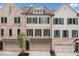 Charming townhome with brick and siding, featuring a two-car garage and manicured landscaping at 1045 Endeavour Ct, Marietta, GA 30064