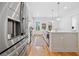 A well-lit kitchen with stainless steel appliances, a center island, and white cabinetry at 1045 Endeavour Ct, Marietta, GA 30064
