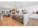 Open-concept kitchen and living area with a large island, seating, and stainless steel appliances at 1045 Endeavour Ct, Marietta, GA 30064