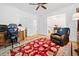 Comfortable living room with hardwood floors, a ceiling fan, and bookshelves for relaxing and entertaining at 1045 Endeavour Ct, Marietta, GA 30064