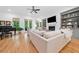 Bright living room featuring a fireplace, TV, built-in shelving and hardwood floors at 1045 Endeavour Ct, Marietta, GA 30064