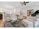 Spacious living room with stylish furniture, area rug, grand piano, and access to the dining area at 1045 Endeavour Ct, Marietta, GA 30064