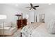 Well-lit main bedroom showcases a four-poster bed, sitting area, and hardwood floors at 1045 Endeavour Ct, Marietta, GA 30064