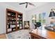 Comfortable home office with built-in bookshelves, a wooden desk, and plenty of natural light at 1045 Endeavour Ct, Marietta, GA 30064