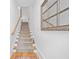 Carpeted staircase leading upstairs with a wooden handrail and a decorative mirror on the wall at 1045 Endeavour Ct, Marietta, GA 30064