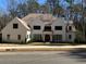 An impressive exterior view of a modern home with a manicured lawn and beautiful landscaping at 1303 Cobblemill Nw Way, Kennesaw, GA 30152